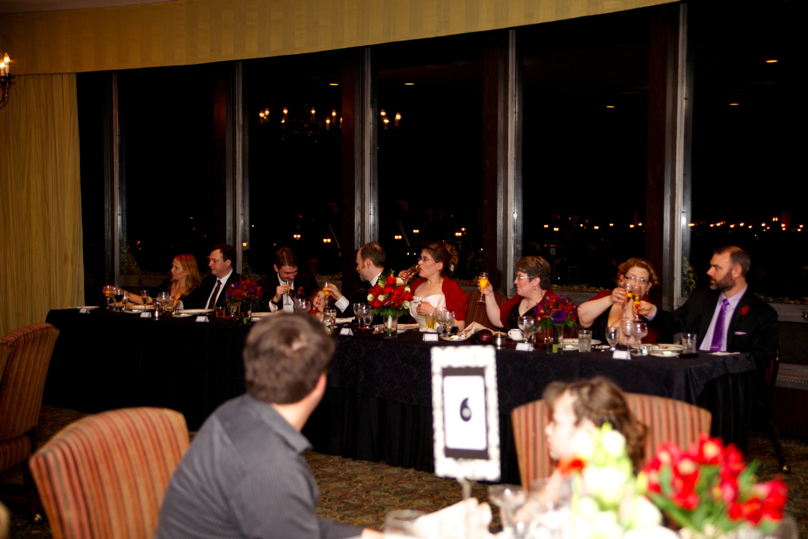 Head Table Raises Glasses To Henry's Toast